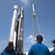 NASA astronauts Suni Williams, left, Barry "Butch" Wilmore, center, and Mike Fincke, right, watch as a United Launch Alliance Atlas V rocket with Boeing’s CST-100 Starliner spacecraft aboard is rolled out of the Vertical Integration Facility to the launch pad at Space Launch Complex 41 ahead of the Orbital Flight Test-2 (OFT-2) mission, Wednesday, May 18, 2022, at Cape Canaveral Space Force Station in Florida.